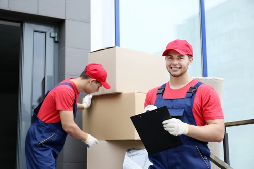 Removal team sorting recyclable packing materials in Belgravia