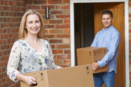 Careful packing of fragile household items in central London