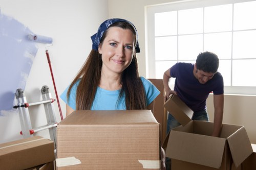 Office relocation planning in Belgravia with moving boxes and workspace setup