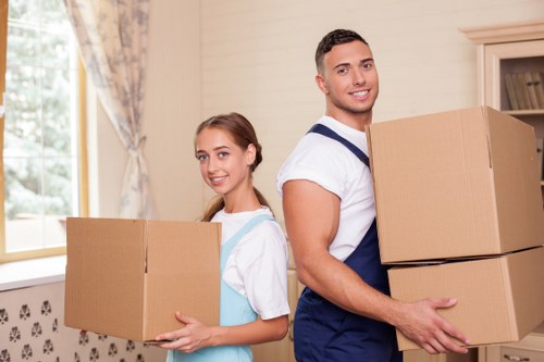 Careful loading of student belongings near a Belgravia flat
