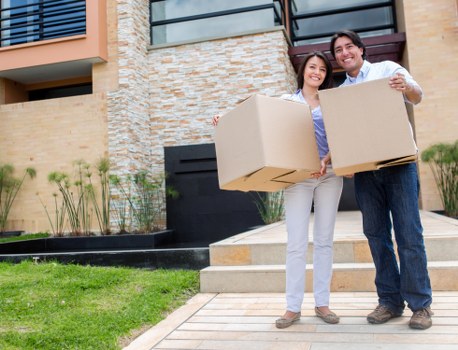 Professional movers handling household items in a Belgravia property